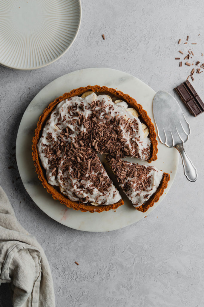 Top view, banoffee pie with a slice taken out.