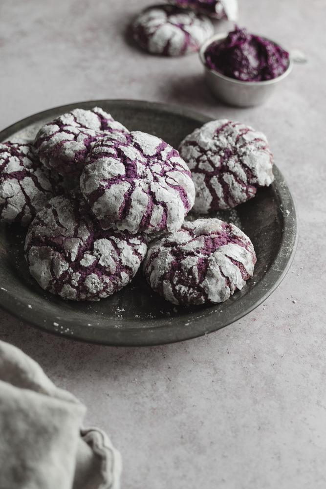 45 degree angle of a plate of vegan ube crinkle cookies