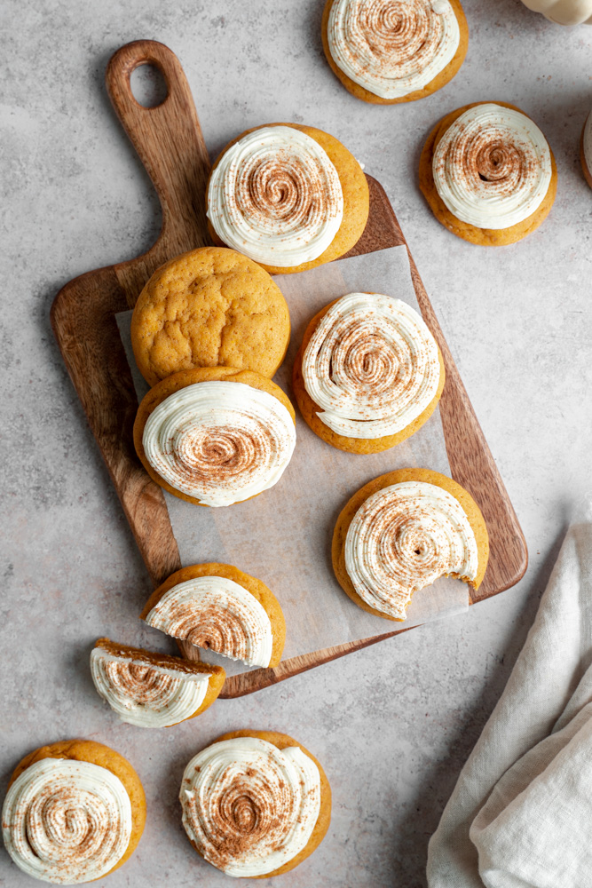 Vegan pumpkin spice cookies spread over a wooden board.