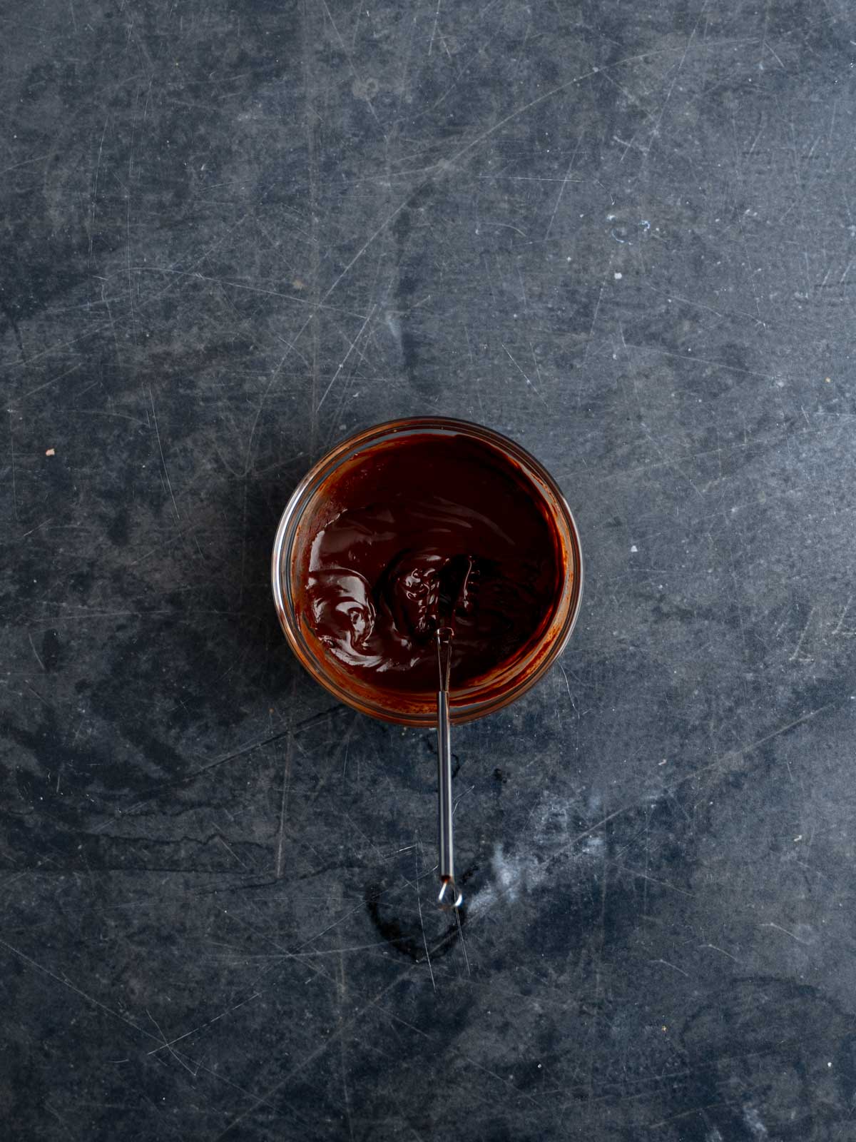Ganache mixed in a glass mixing bowl.