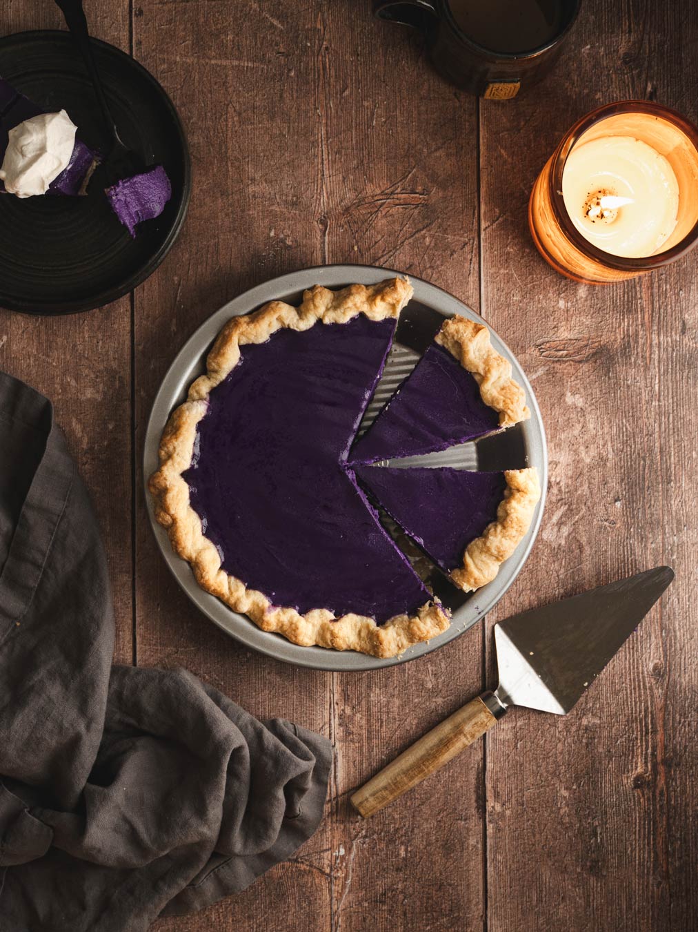 Ube pie sliced into three pieces.