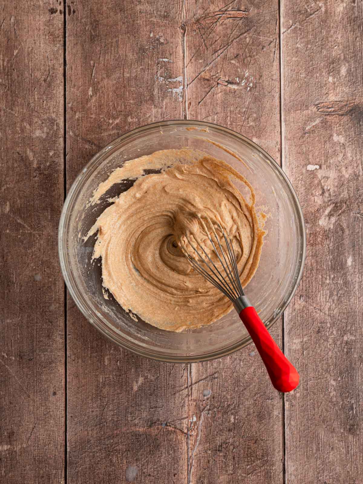 Vegan brown butter and dairy-free milk whisked in a bowl.