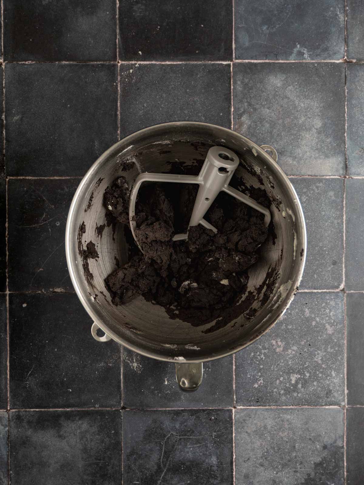 Black cocoa dough mixed in a bowl.