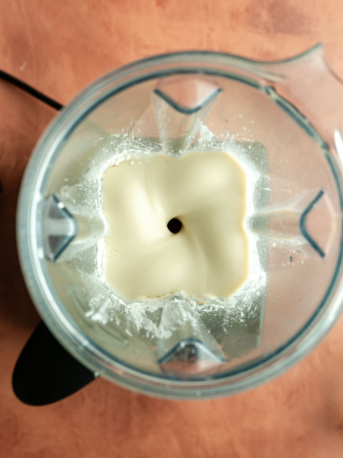 Blending the flan ingredients in a blender.