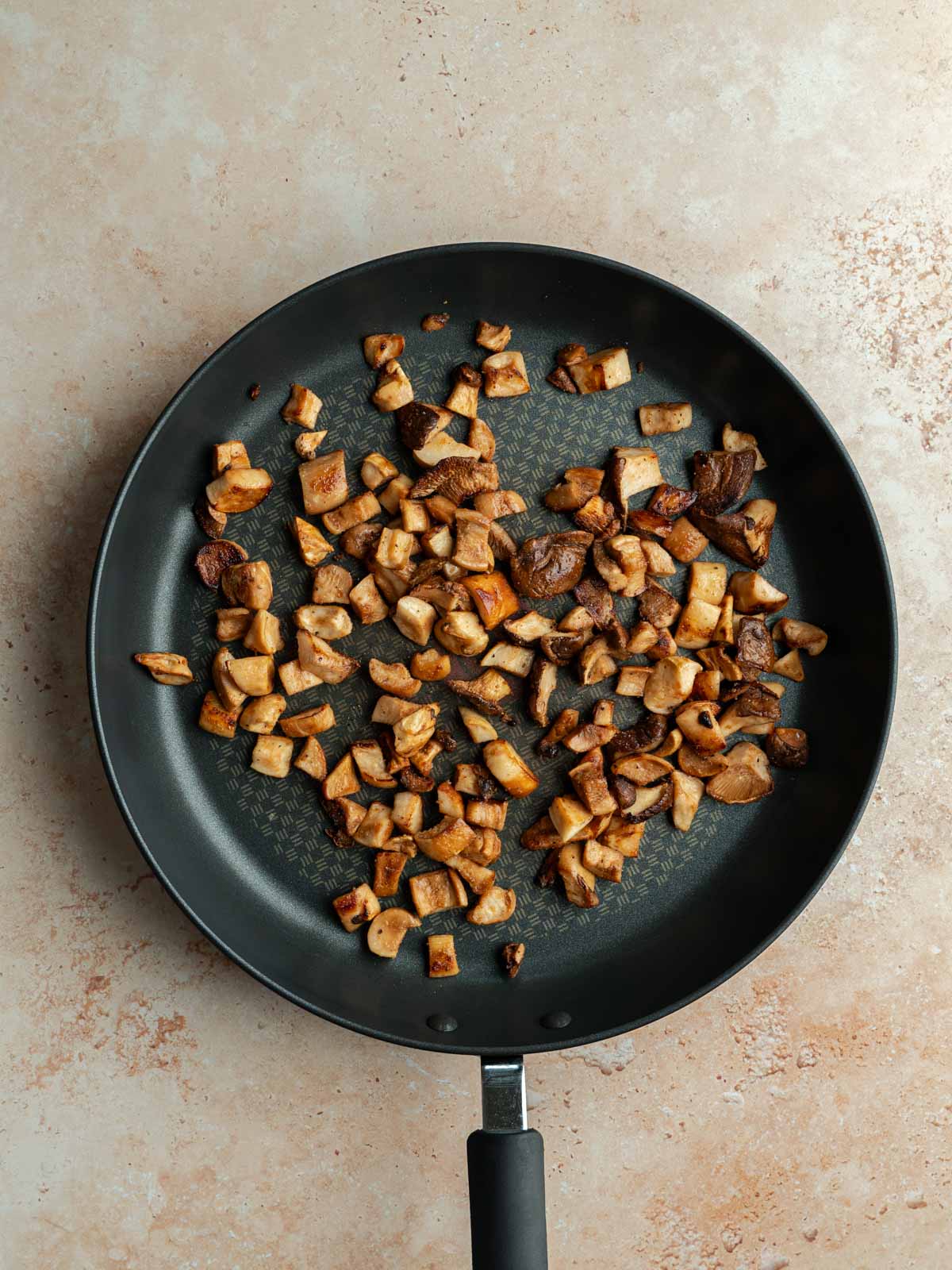 Cooked oyster mushrooms in a pan.