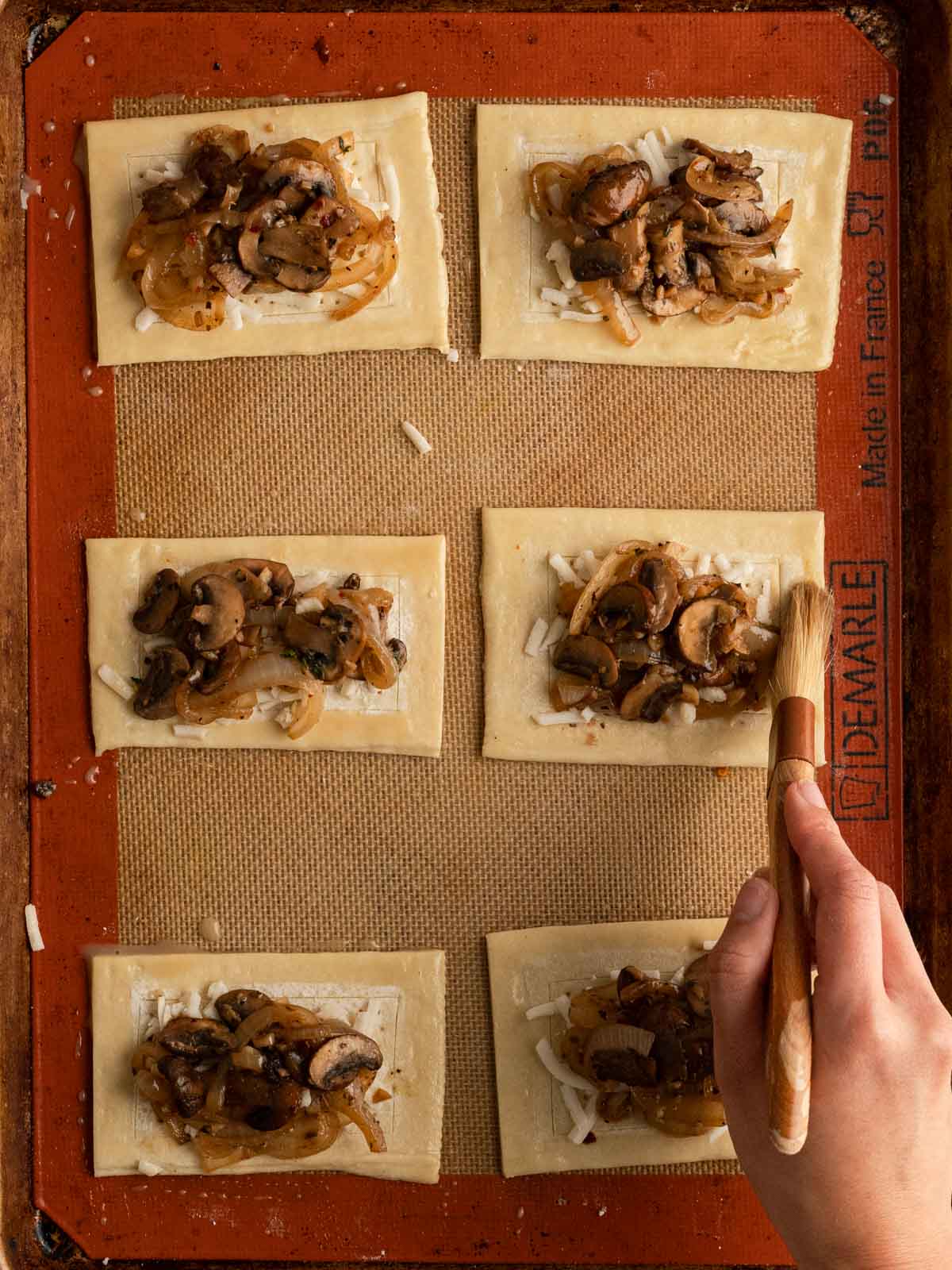 Vegan egg wash brushed over the edges of the puff pastry.