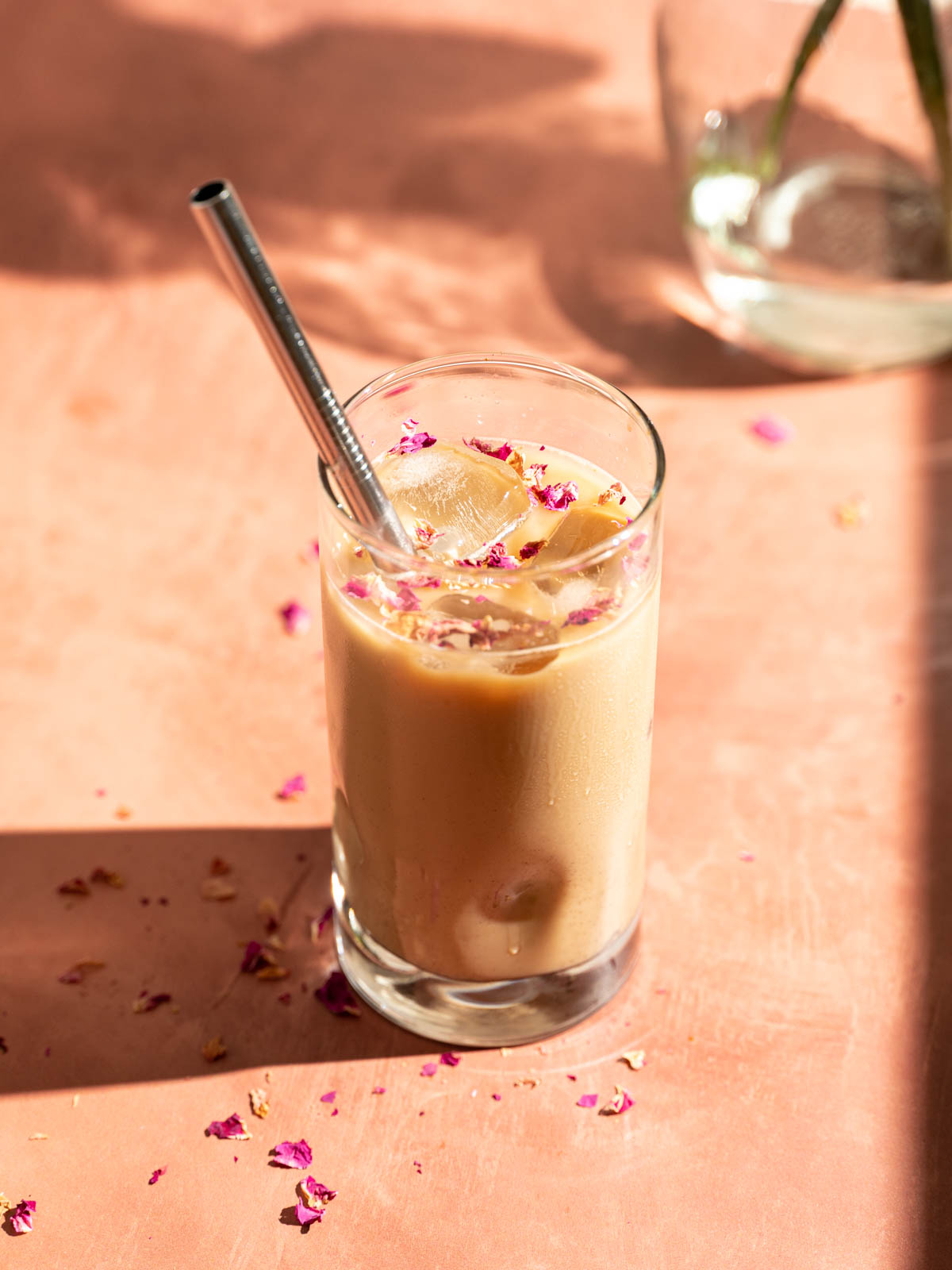 A glass of rose cardamom with.