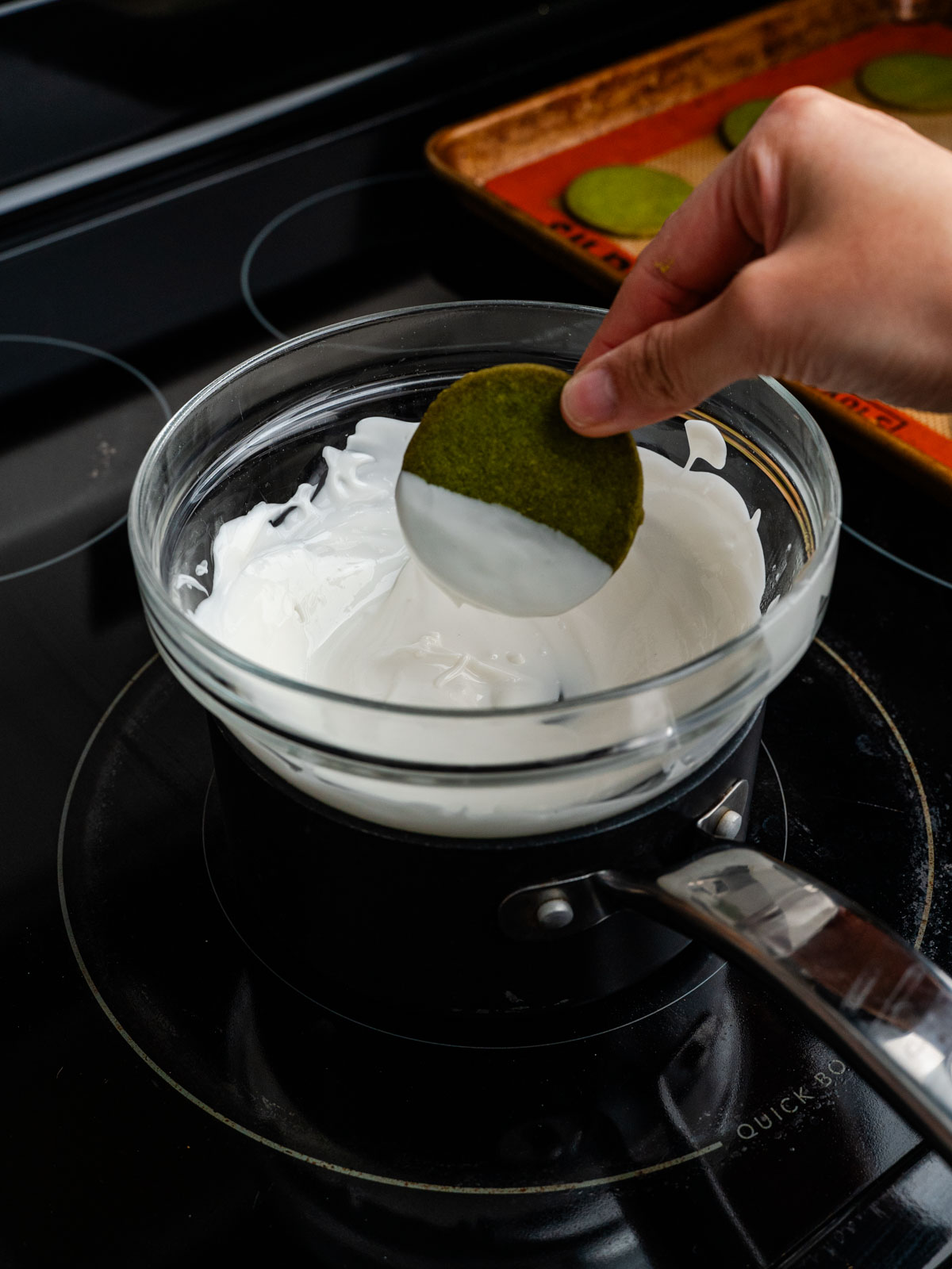 Matcha shortbread cookie dipped in white chocolate.