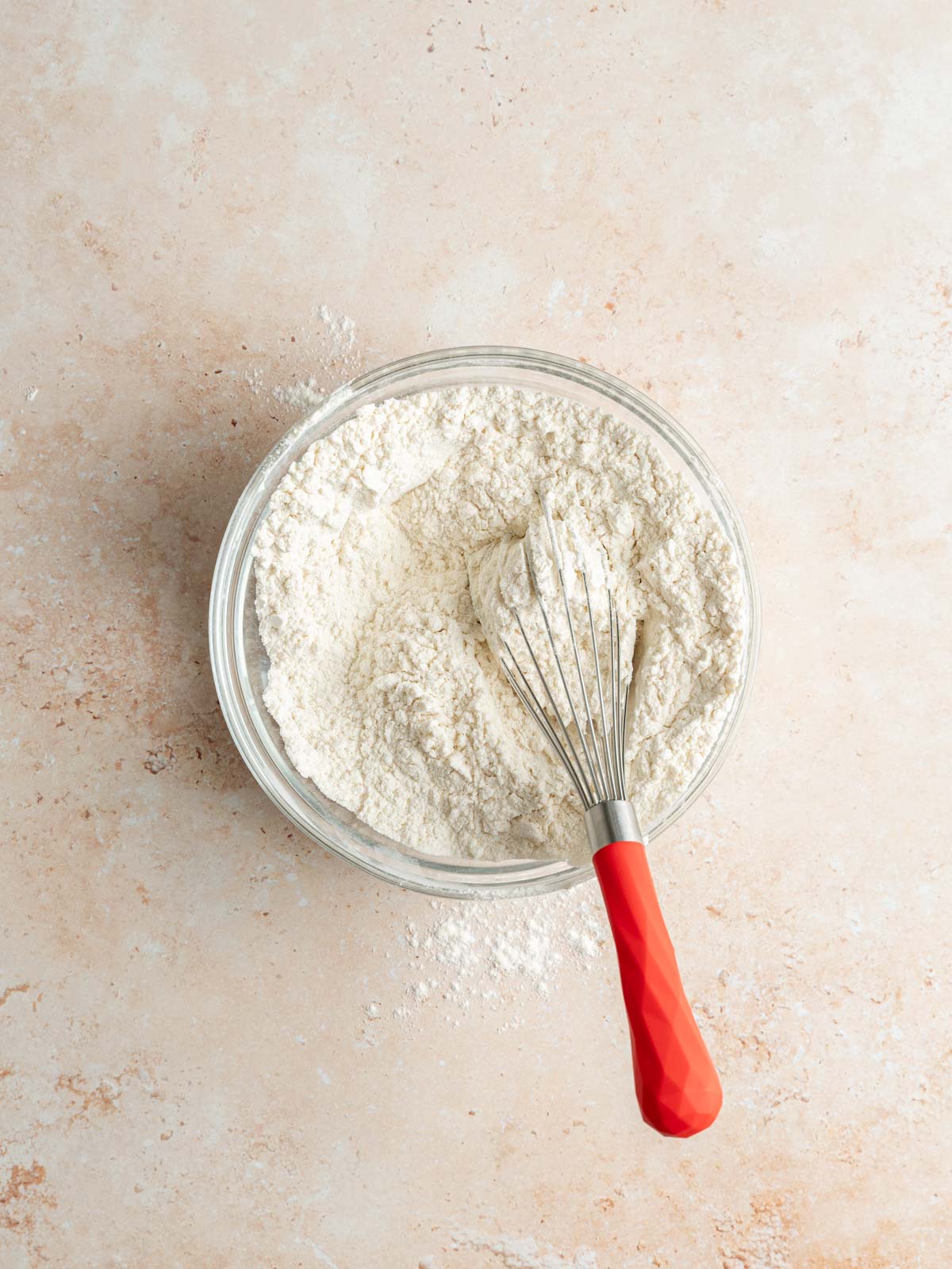 Mixing dry ingredients in a bowl.