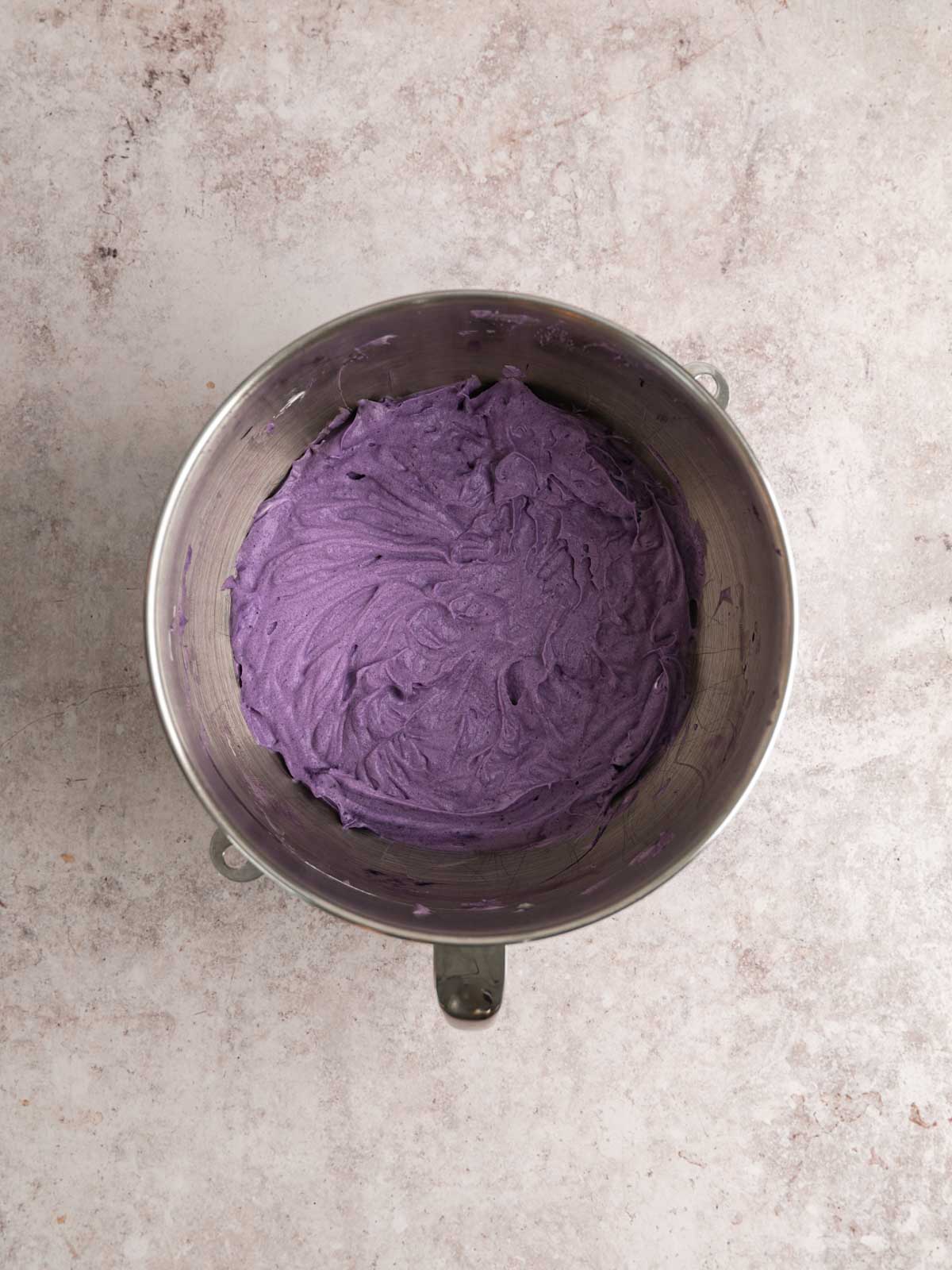 Ube halaya, condensed milk, ube extract, salt and xantham gum added to the whipping cream.