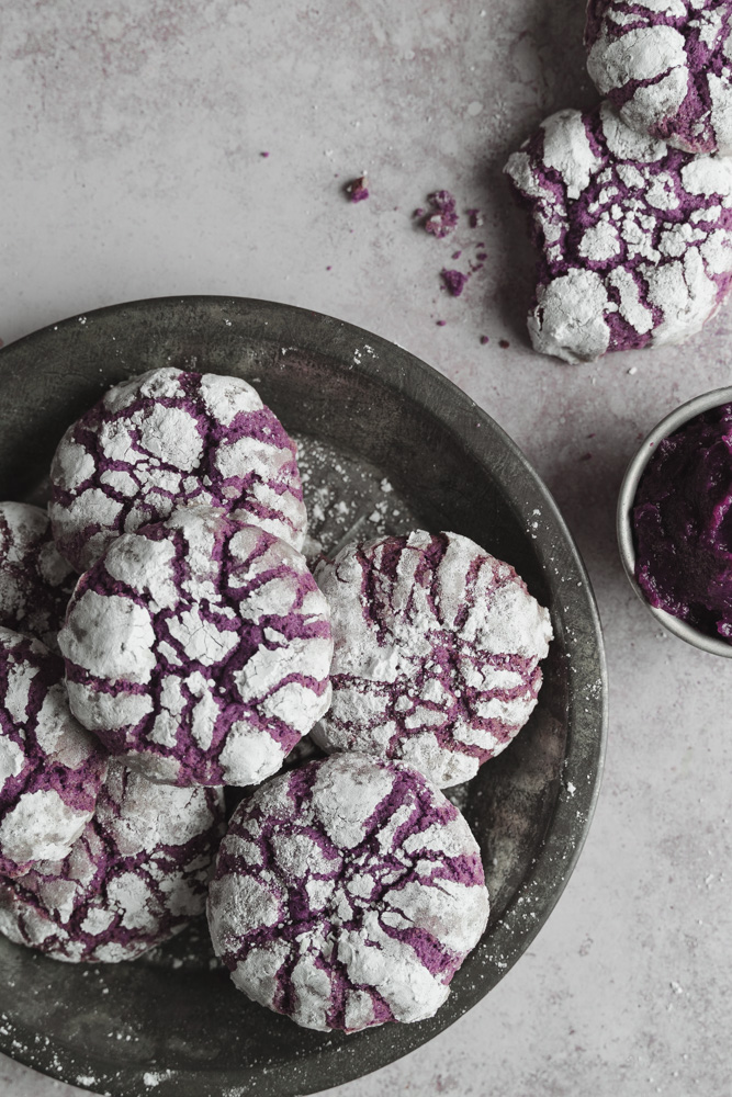 top view of a plate of vegan ube crinkle cookies