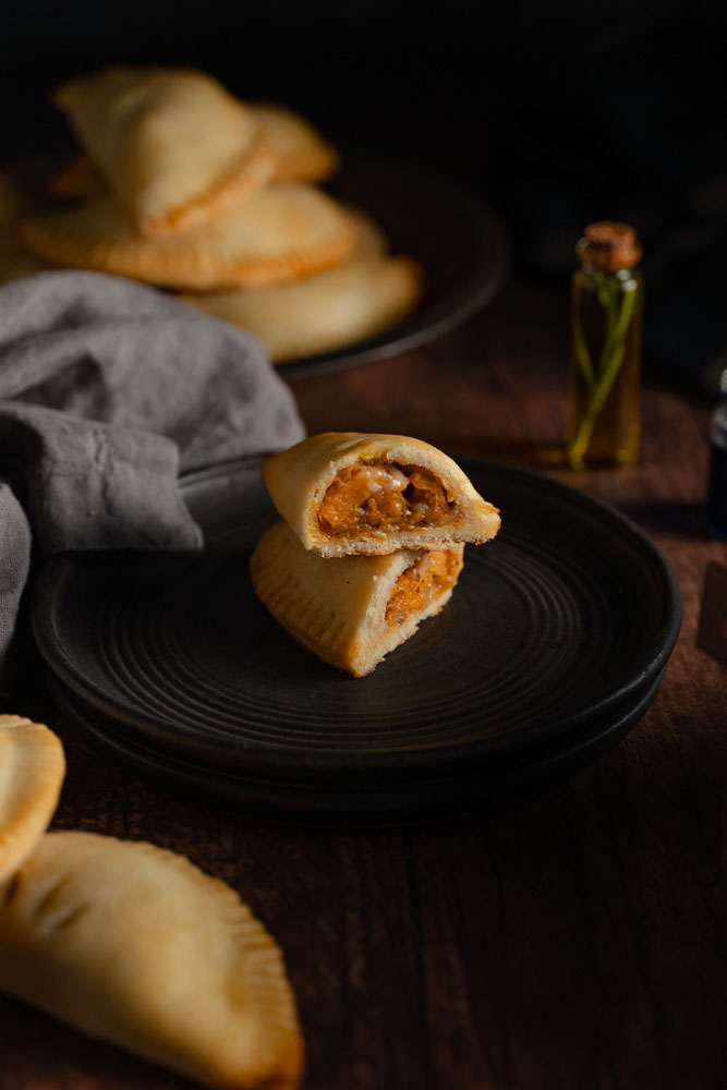 One pasty cut in half, showing the filling.