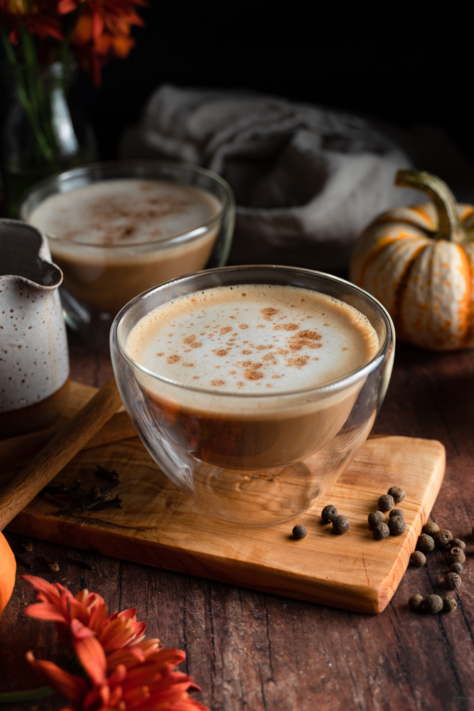 A mug full of vegan pumpkin spice latte.