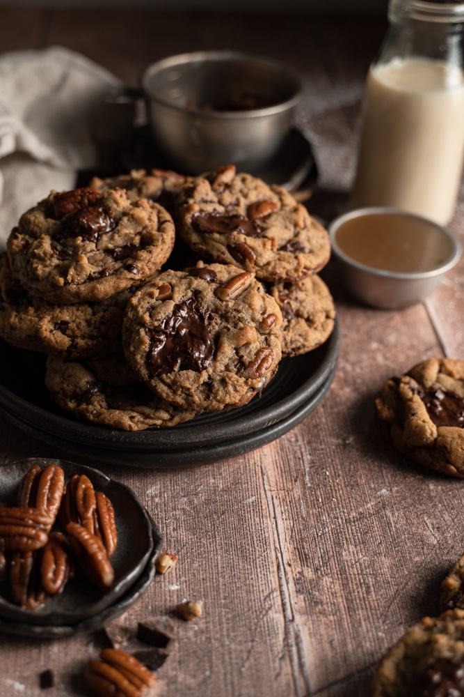 A plate full of vegan brown butter chocolate chip cookies.