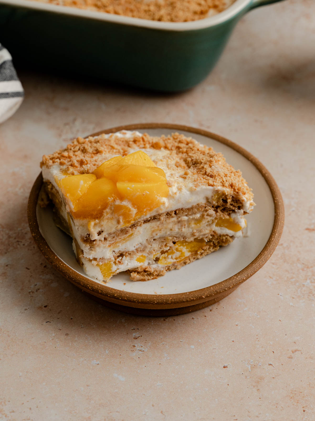 A piece of vegan mango float on a plate.