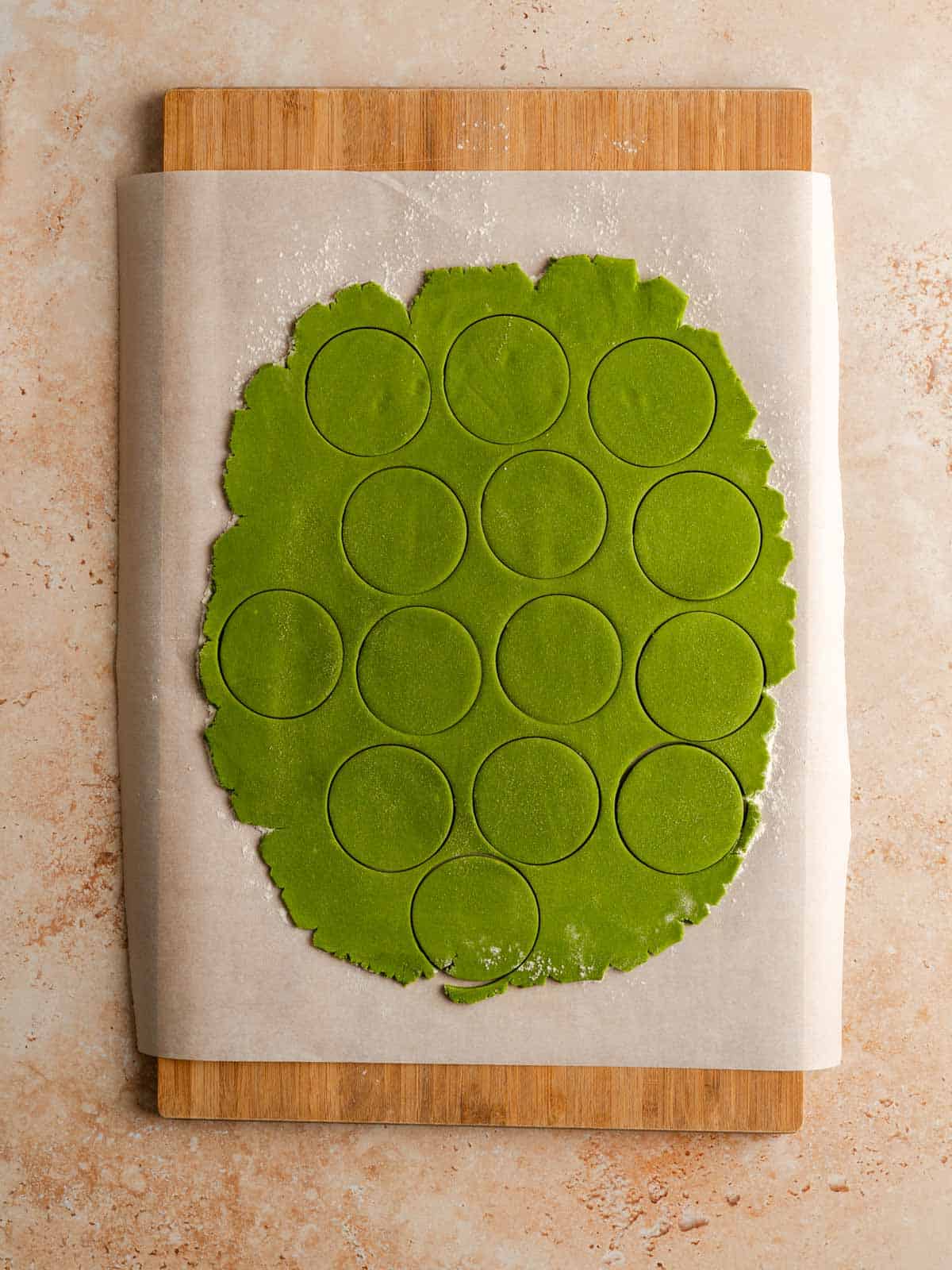 Circle cookie cut outs in the matcha dough.