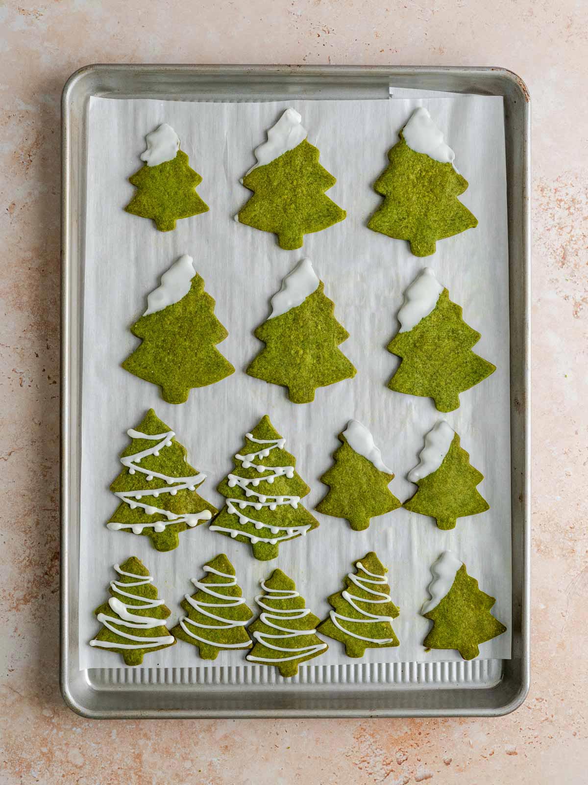 Vegan matcha shortbread cookies shaped as Christmas trees.