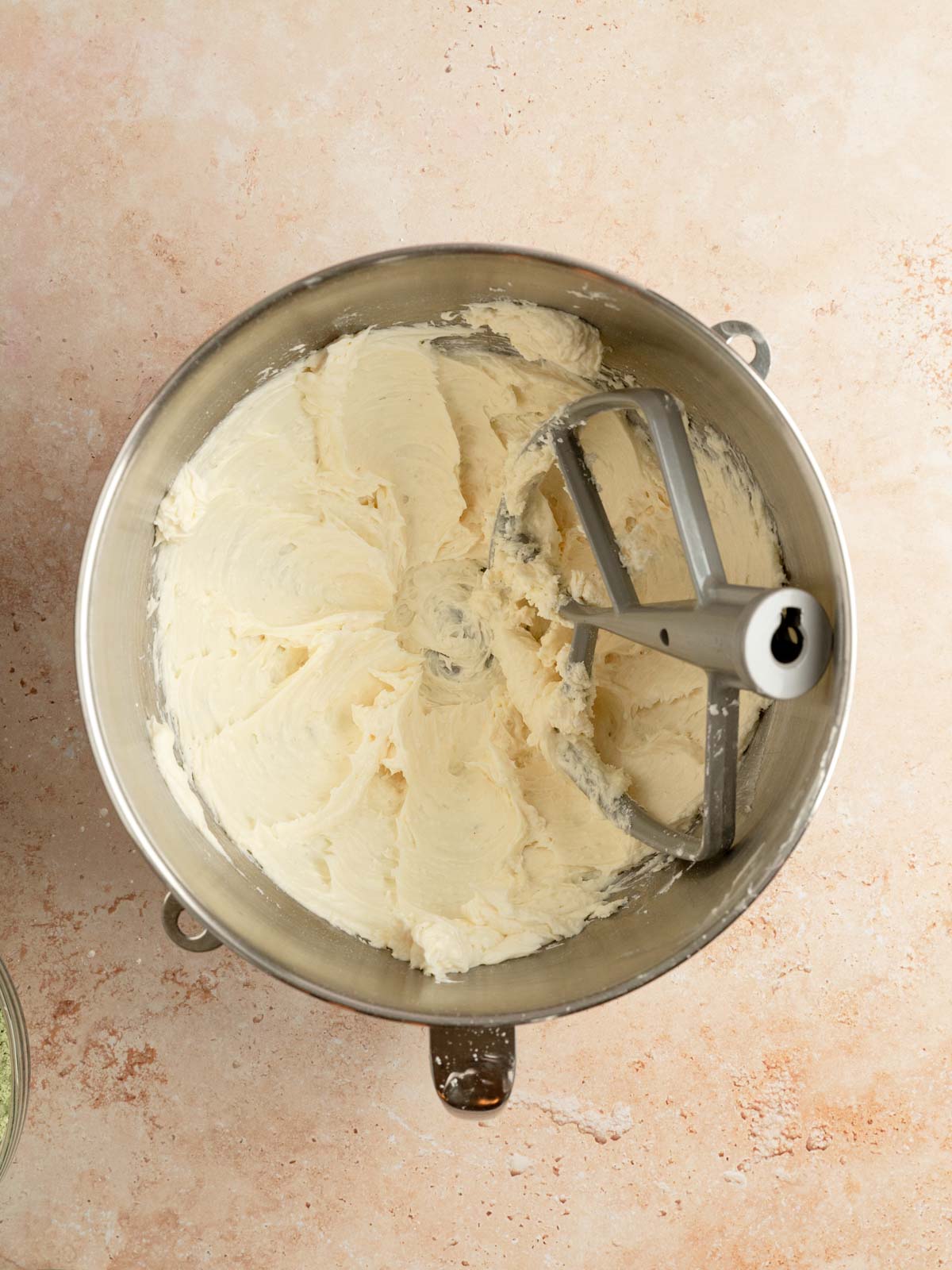 Vegan butter and powdered sugar creamed in a bowl.